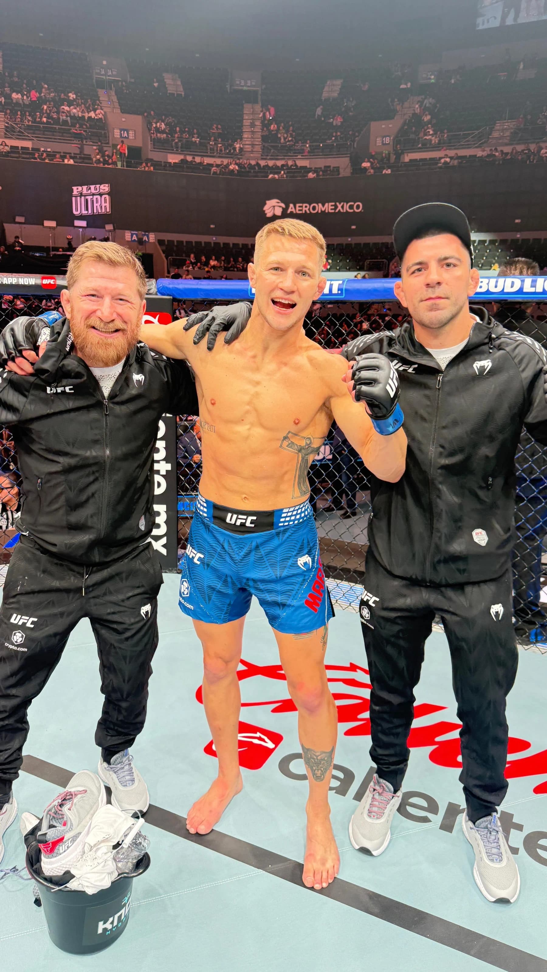 Francis Marshall celebrating in the Octagon with his corner