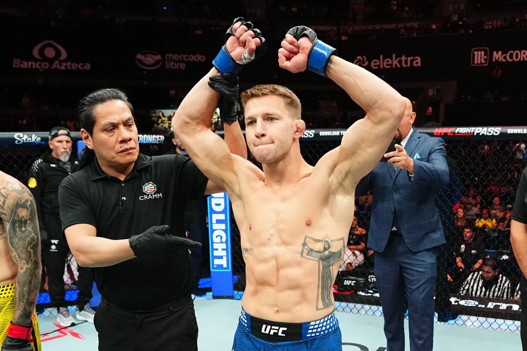 Francis Marshall with both arms raised after a UFC victory