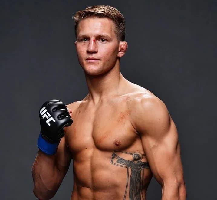 Francis Marshall in an official fighter portrait wearing MMA gloves